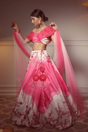 Hand-embroidered custom lehenga fabric detailing at Apreksha Design House atelier